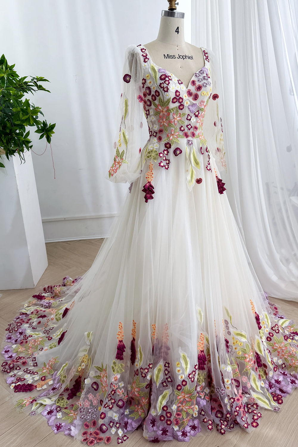 Flowing handcrafted masterpiece radiates storybook charm through voluminous draping ornate vines surrounding majestic presentation