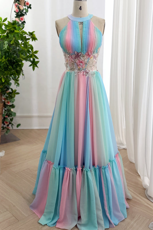 Rainbow floor-length maxi features high neckline, embroidered corset panel, ruffled hem displayed beside window curtains pose