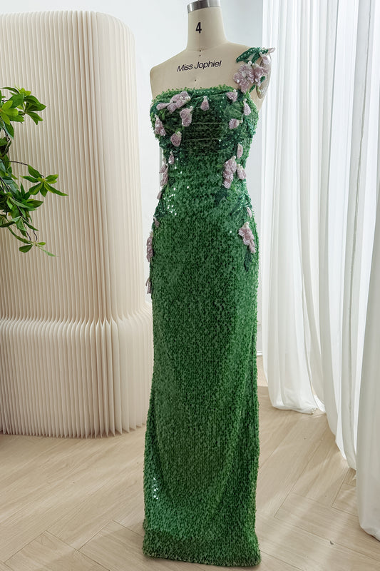 Angled front view of a fitted green sequin gown with pale pink floral appliques and green leaves across the bodice and hips.