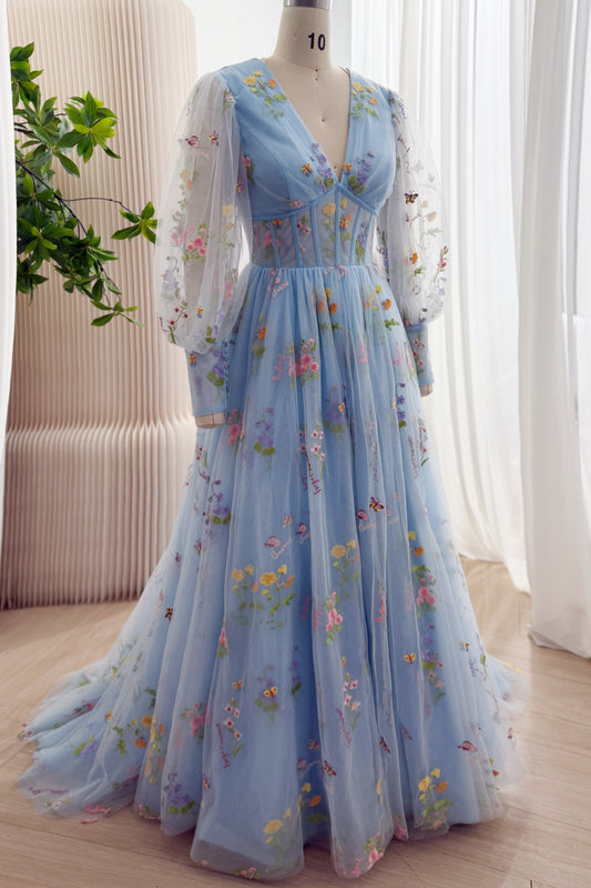 Angled front view of a sky blue floral embroidered gown with a corset-style bodice and full tulle skirt