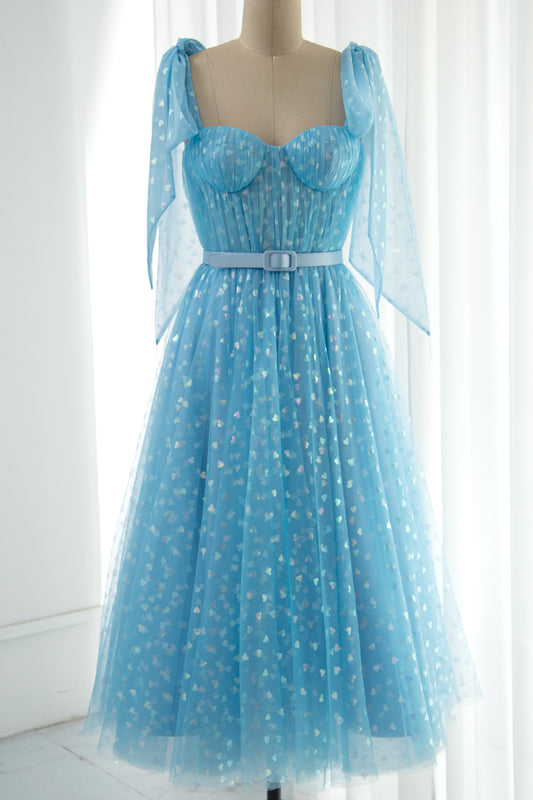 Blue sweetheart midi tulle dress with glitter hearts and matching belt styled with optional tie shoulder straps shown on mannequin