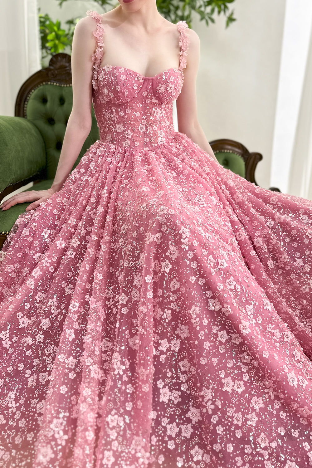 Romantic blush pink gown with 3D floral straps, fitted corset bustier, and flowing sequin tulle skirt for prom evening gala
