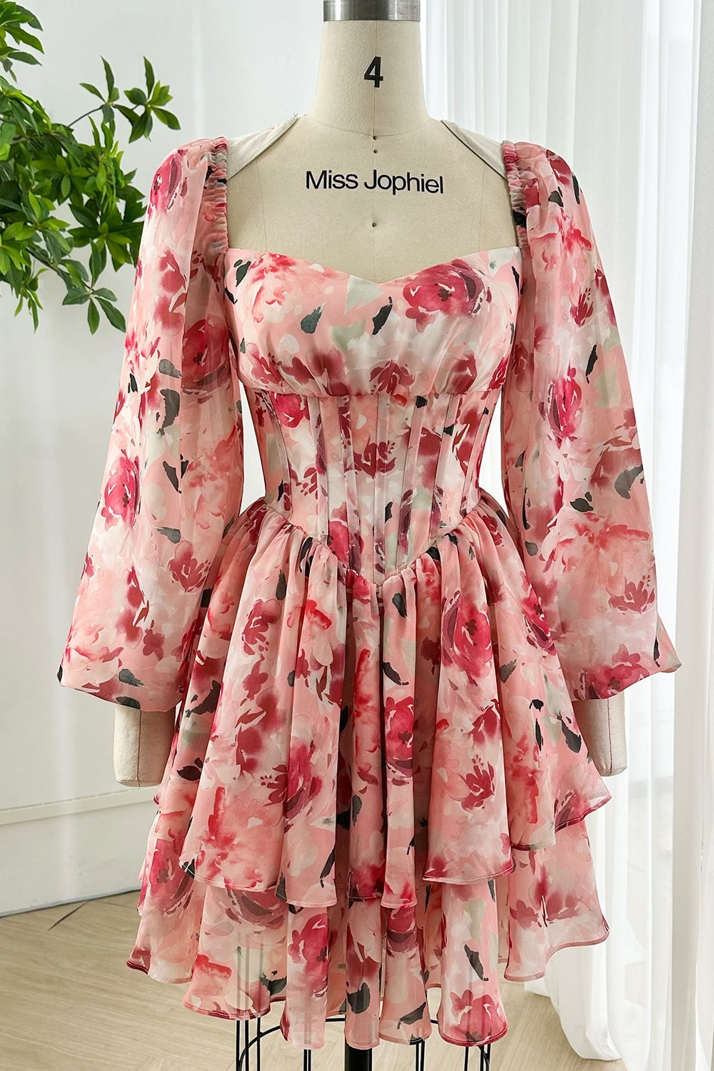 Romantic pink floral chiffon mini dress with sweetheart neckline, corset bodice, ruffle hem and puff sleeves perfect for weddings and garden parties
