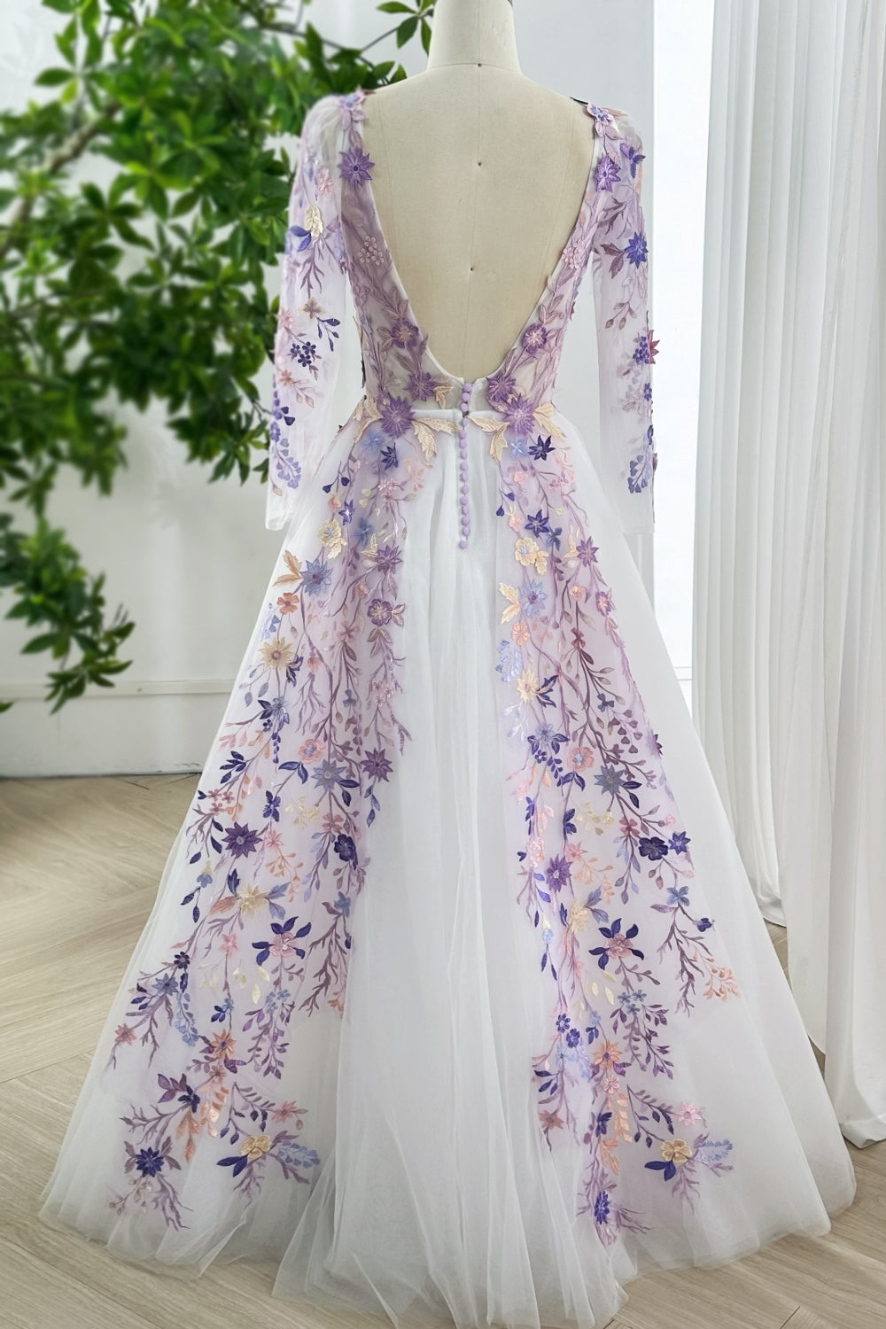 Pastel embroidered gown with open back button detailing sheer long sleeves ideal feminine choice engagement parties outdoor formal receptions