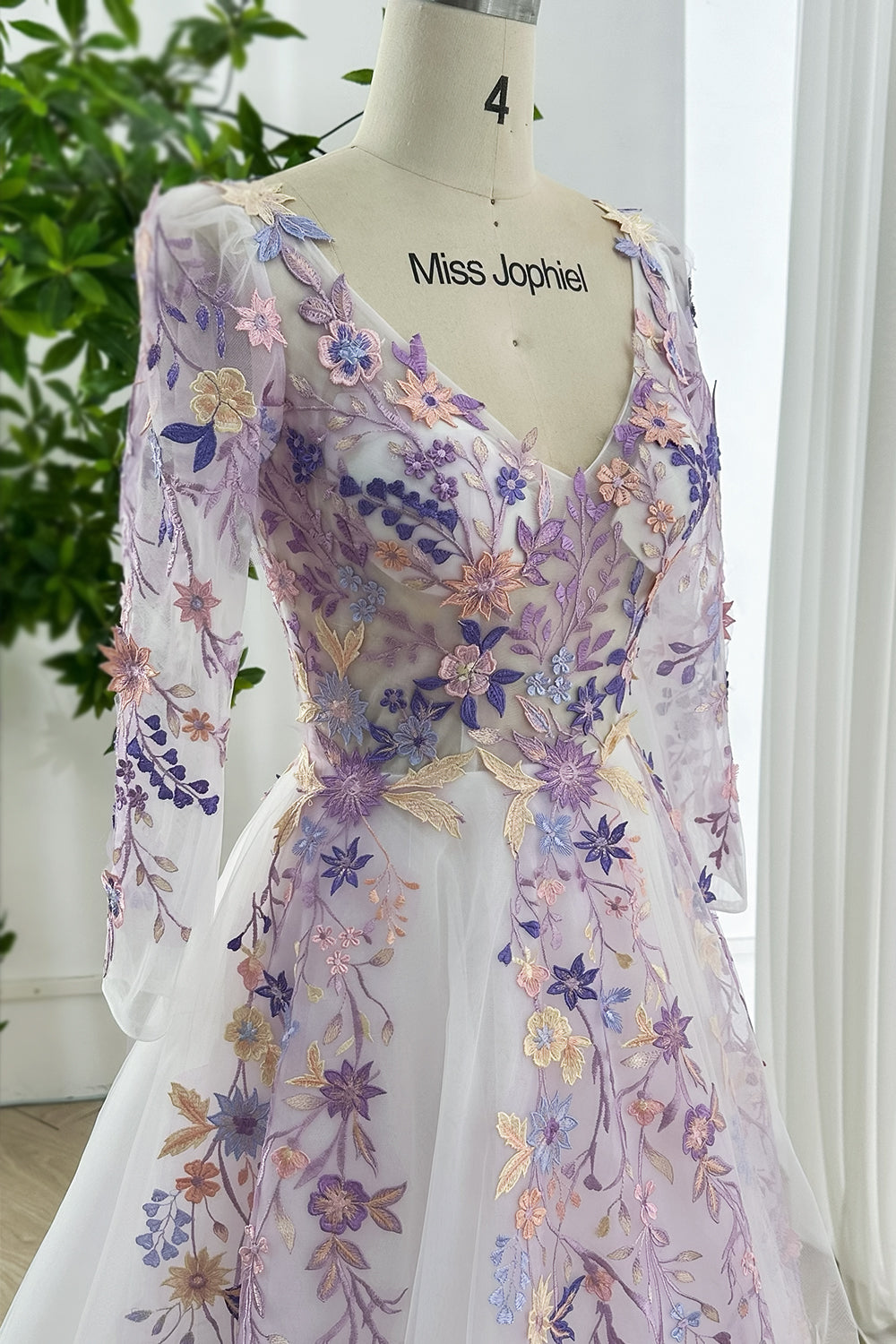 Lavender embroidered floral gown featuring V neckline sheer sleeves pastel design ideal romantic weddings evening galas photography