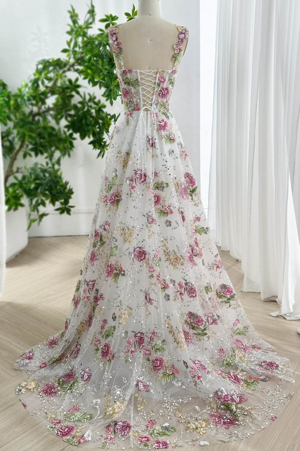 Whimsical floral lace up back gown with cathedral train, sequin details, wide straps, romantic embroidery design, perfect for weddings and galas