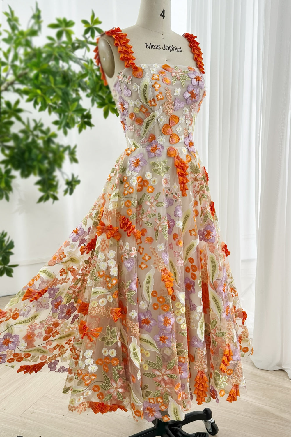 Flowy A-line floral embroidered midi gown in orange lilac hues designed for spring weddings and garden occasions
