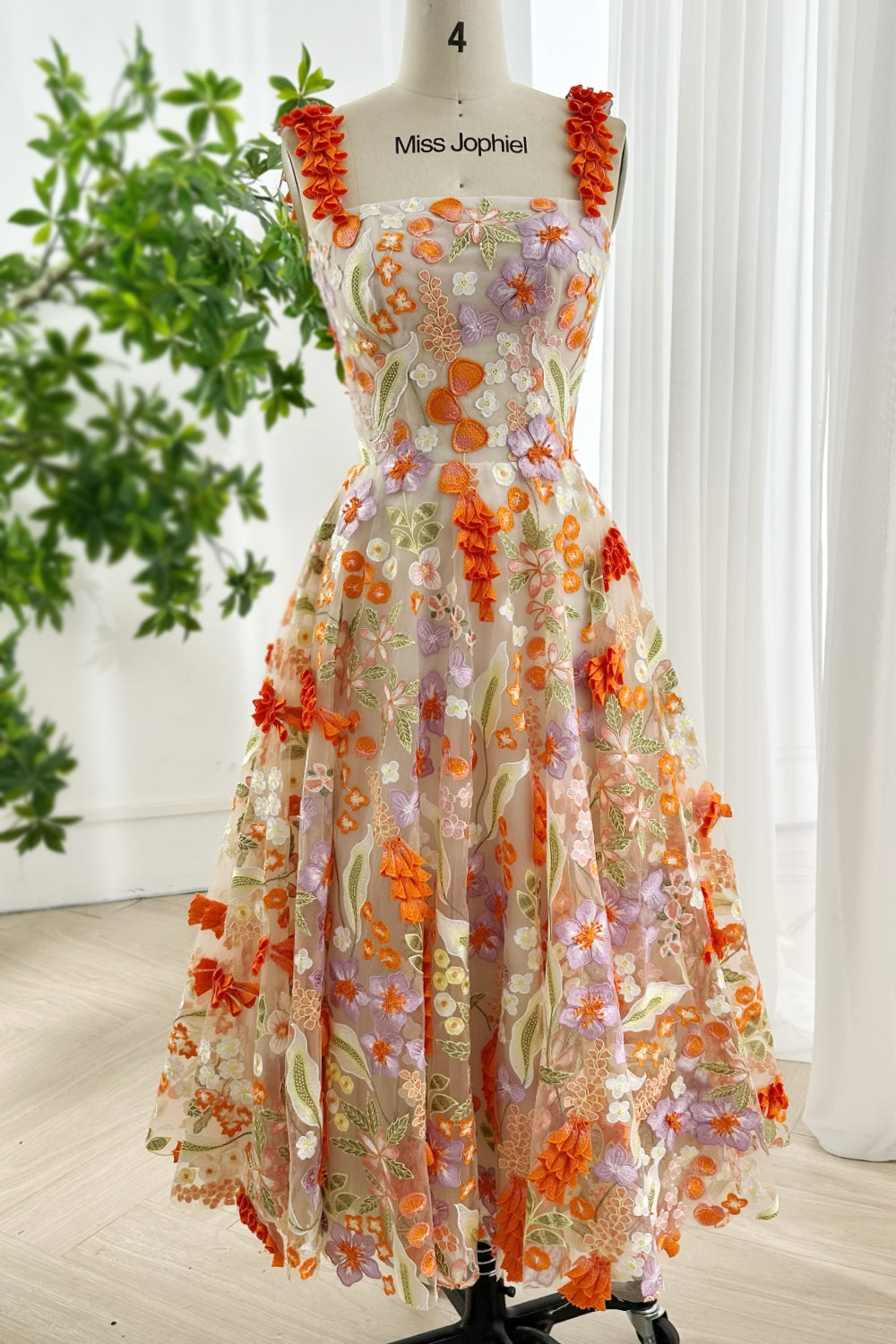 Front view full length multicolor embroidered mesh dress with fitted bodice lace-up back and whimsical flowers