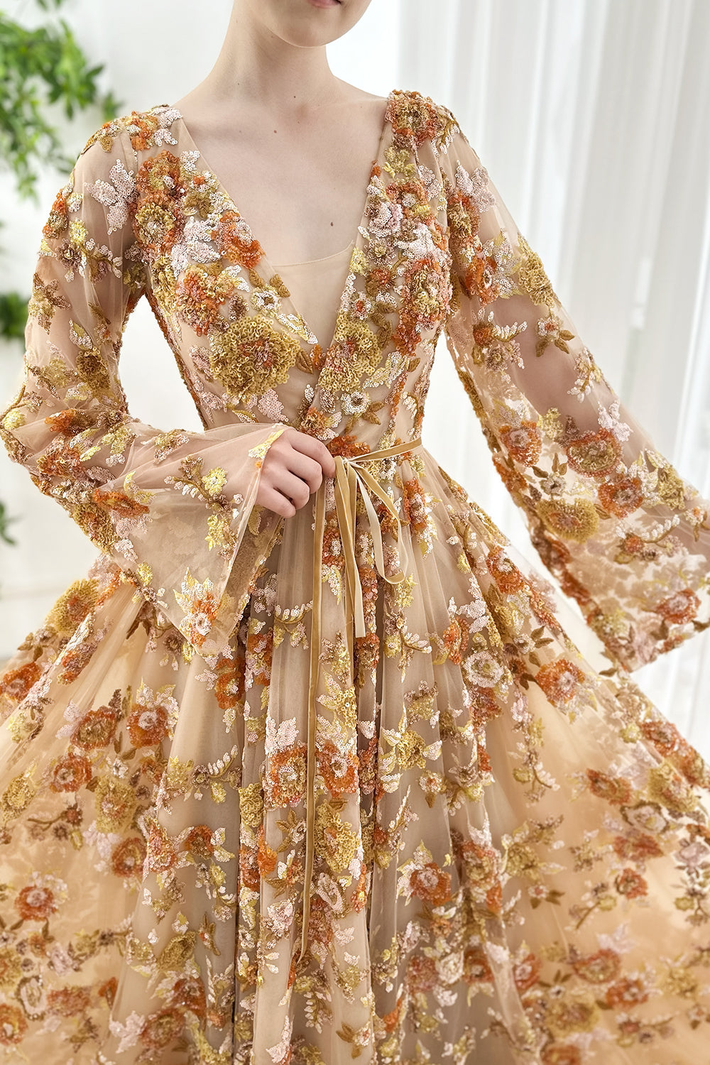 Boho-champagne mesh gown plunging-neckline ornate-sequin blossoms fluttering-bell-sleeves slim-ribbon waist romantic-silhouette