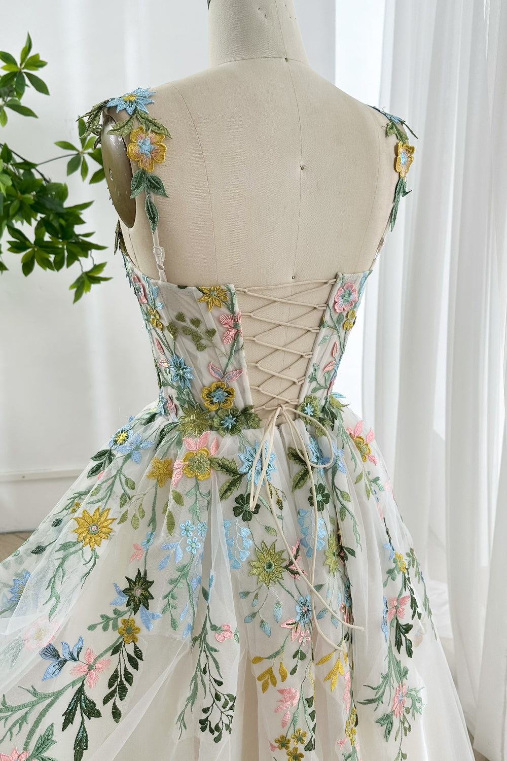 Romantic back lace up embroidered floral tea length dress with corset style bodice soft tulle skirt detailed craftsmanship view