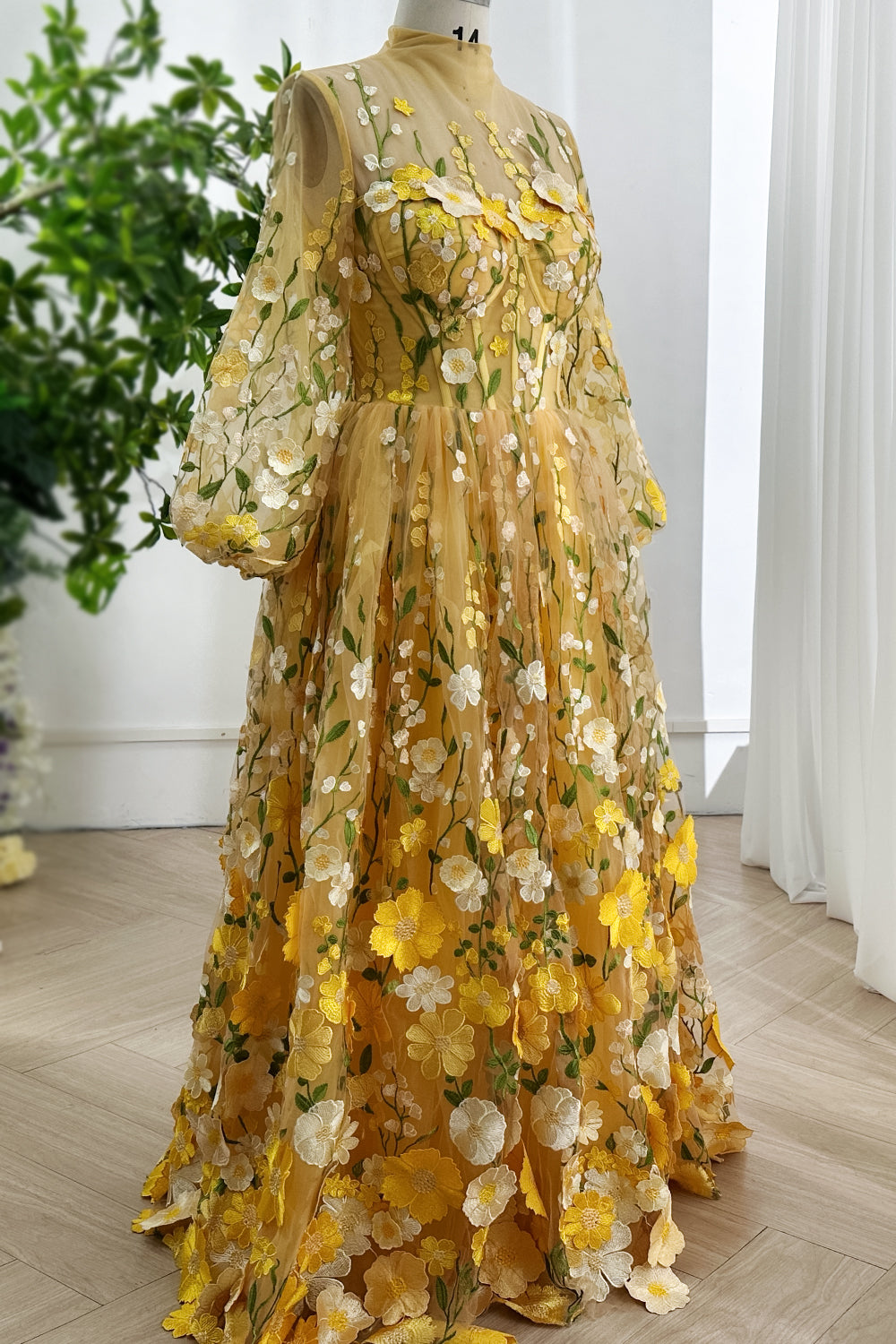 sunshinedelicatetullefloralappliqueballgownbouquetmotiflushsleevesnatureinspiredartistryfloorskimminggracefulmovementglowglow