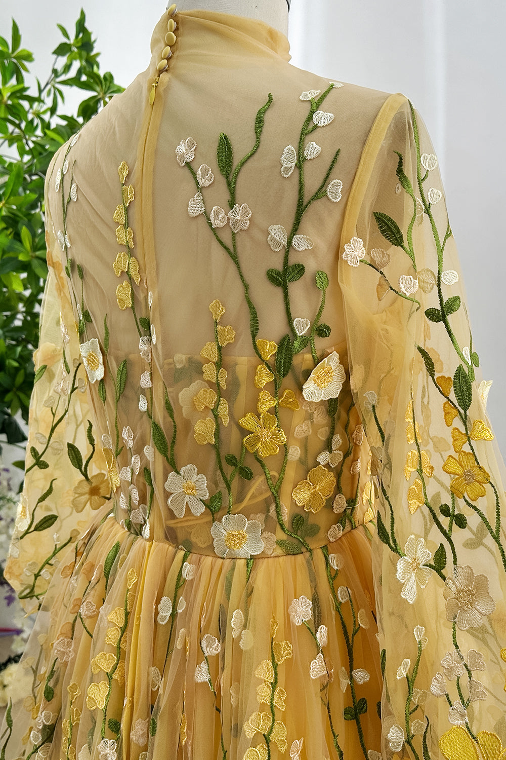 marigoldtullefloralembroideredillusionnecklineballgownbackdetailgardenbloommotifromanticsoftlayersdreamytexturedsilhouettesun