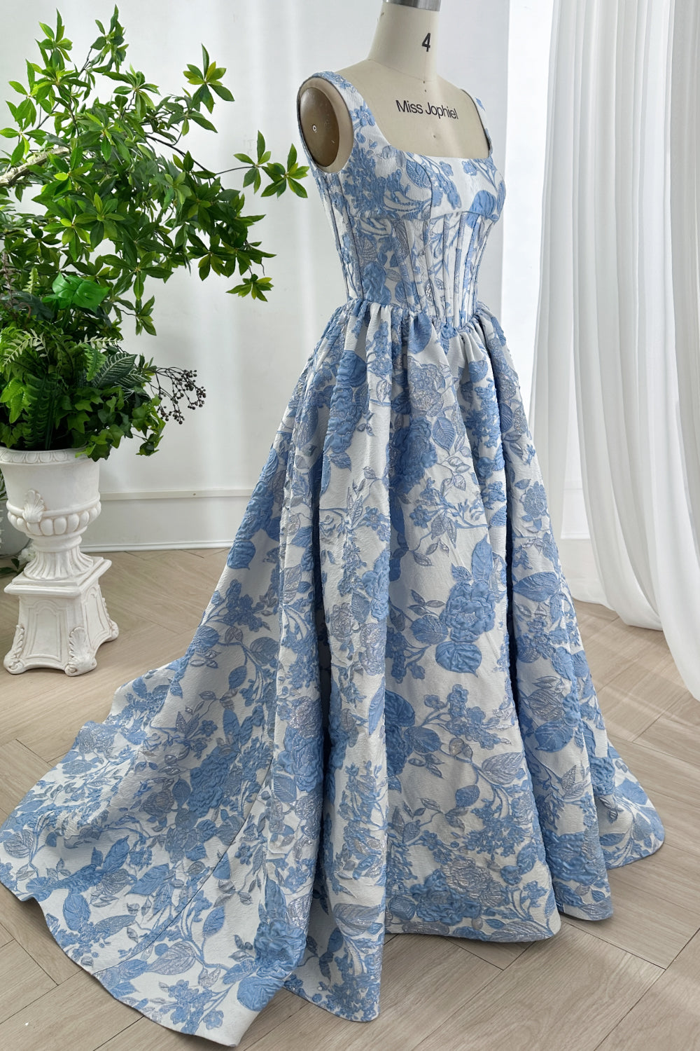 Side profile of voluminous pleated skirt showcasing fairytale A-line silhouette.