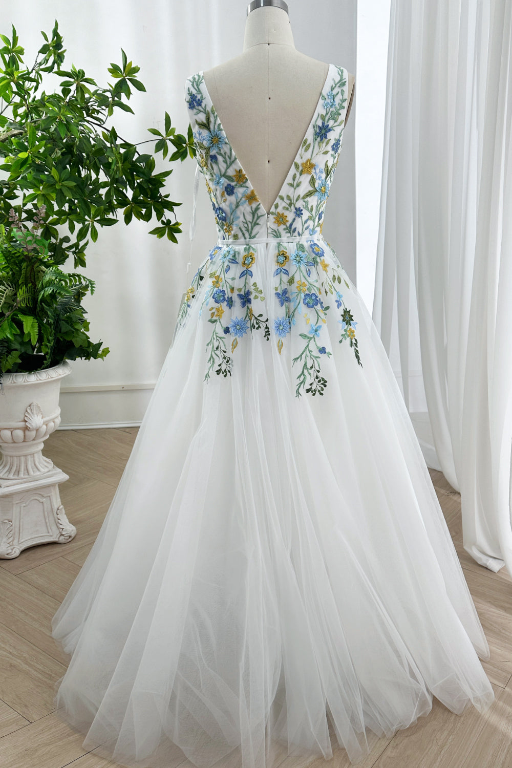 Exquisite cascading petals leaves greenery photoshoot formal attire airy lightweight designer apparel fashion