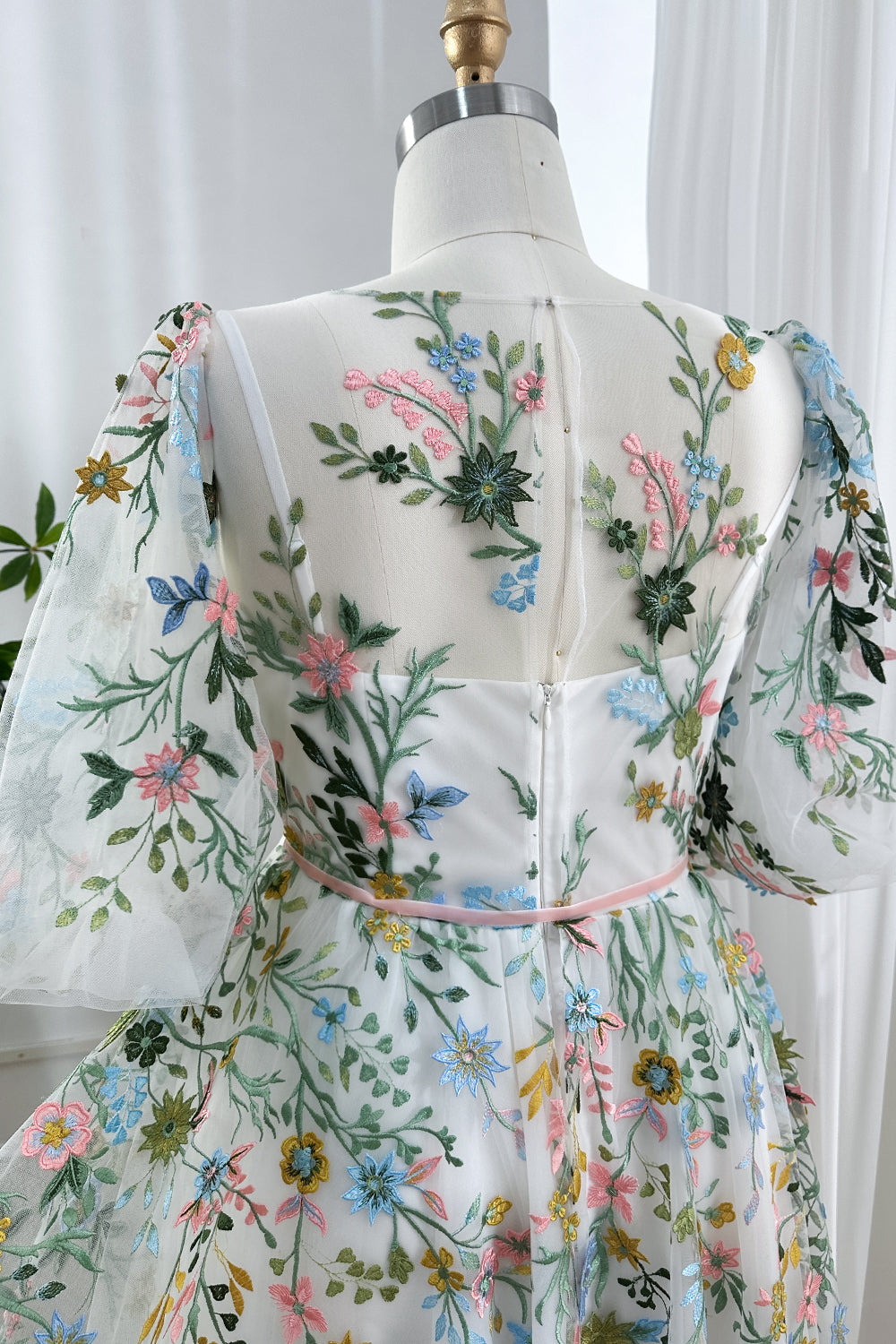 Detailed close-up showing pastel threadwork blossoms including blue daisies plus yellow sunflowers scattered across breathable.