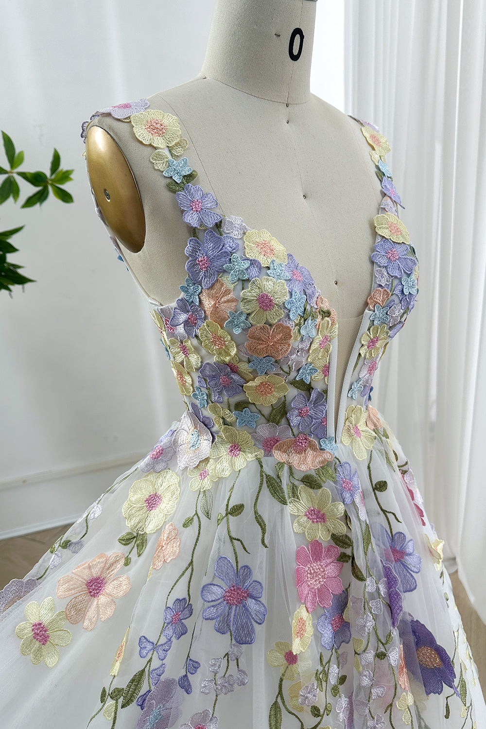 Whimsical flower applique romance corset design wear captured angled closeup emphasizing sculpted waistline colorful stitching delicate translucency