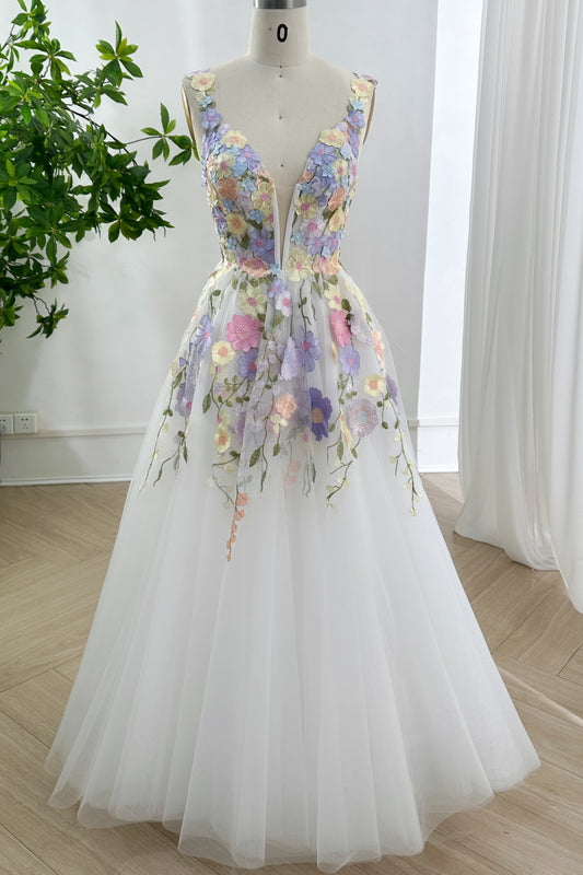 Ethereal pastel botanical bridal aesthetic gown showcased frontally upon mannequin highlighting plunging illusion bodice embroidery tulle skirt serenity