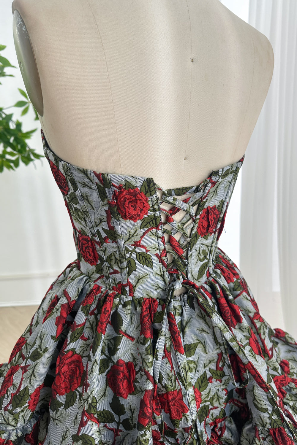 Adjustable corset closure romantic evening outfit highlighting textured weave intricate print tailoring craftsmanship detail