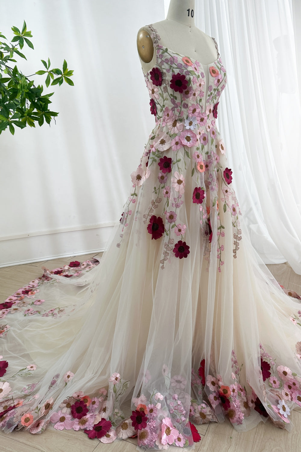 Side angle portrait illustrating whimsical bridal fashion statement with flowing skirt cascading gracefully