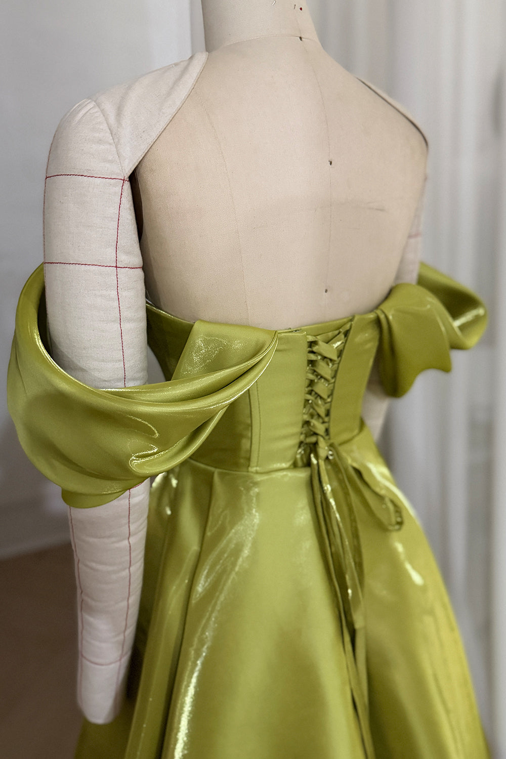Olive satin back detail captures adjustable lacing open shoulders gathered swag panels reflective waist construction