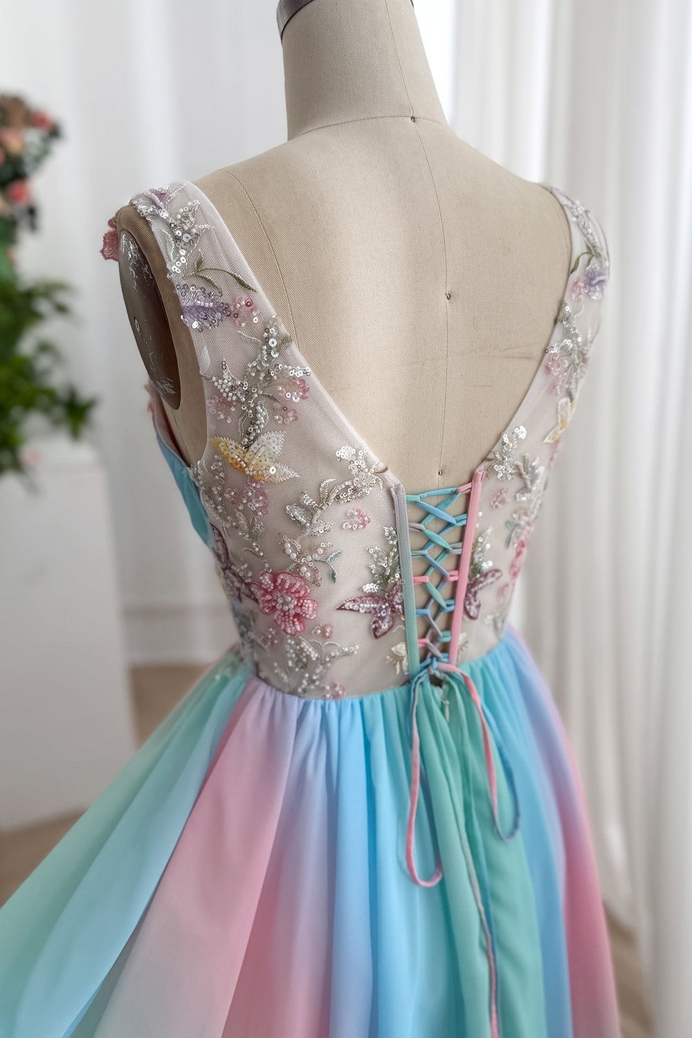 Close front portrait highlights candy tone panels, embroidered illusion shoulders, sparkling appliques, whimsical prom outfit