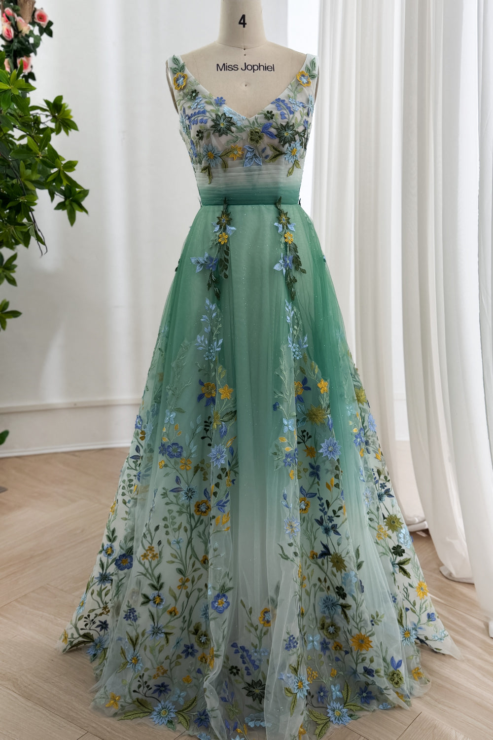 Ivory-sage ombre embroidered tulle gown front, deep V neckline, broad straps, floor skirt, studio mannequin display cataloged