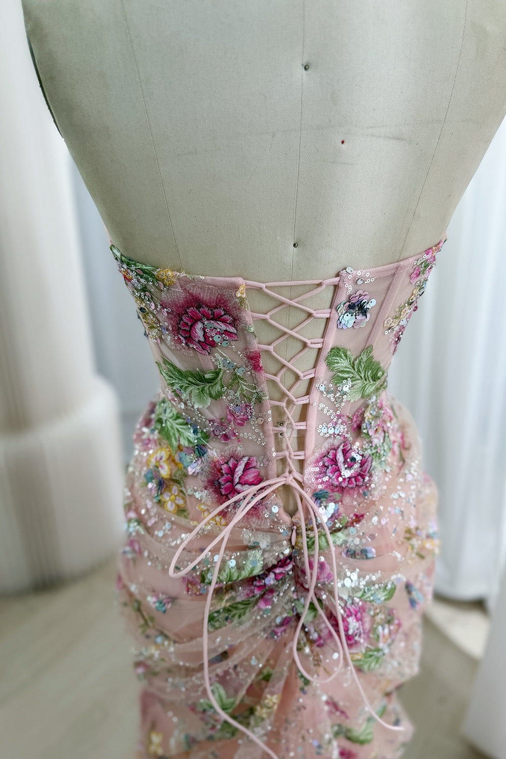 Detailed laced reverse highlights satin ties, illusion panels, leafy beading, romantic couture construction accents, artisan.