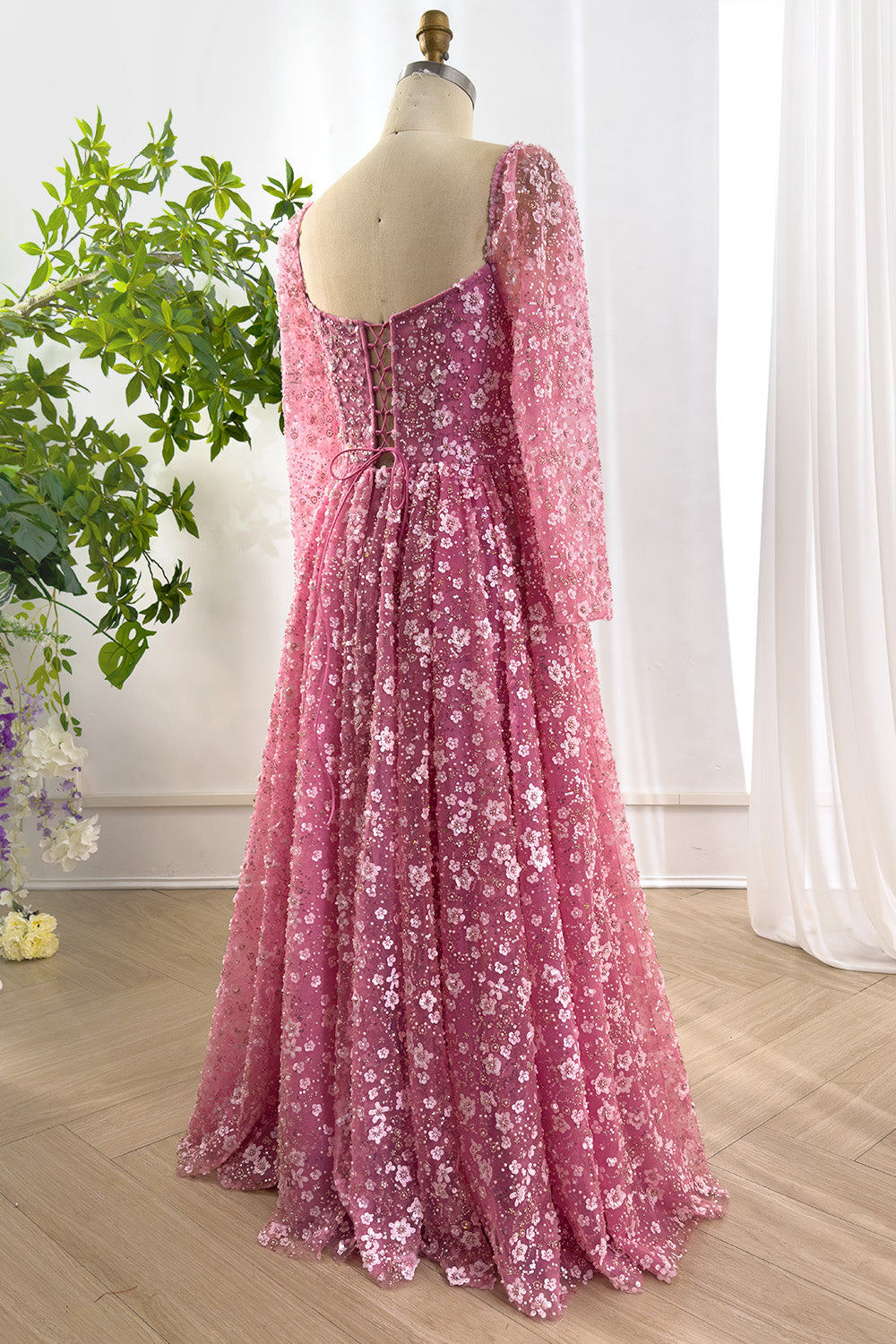 Charming laceup back view presenting graceful drape full skirt enhanced sparkling motifs surrounding feminine silhouette beautifully