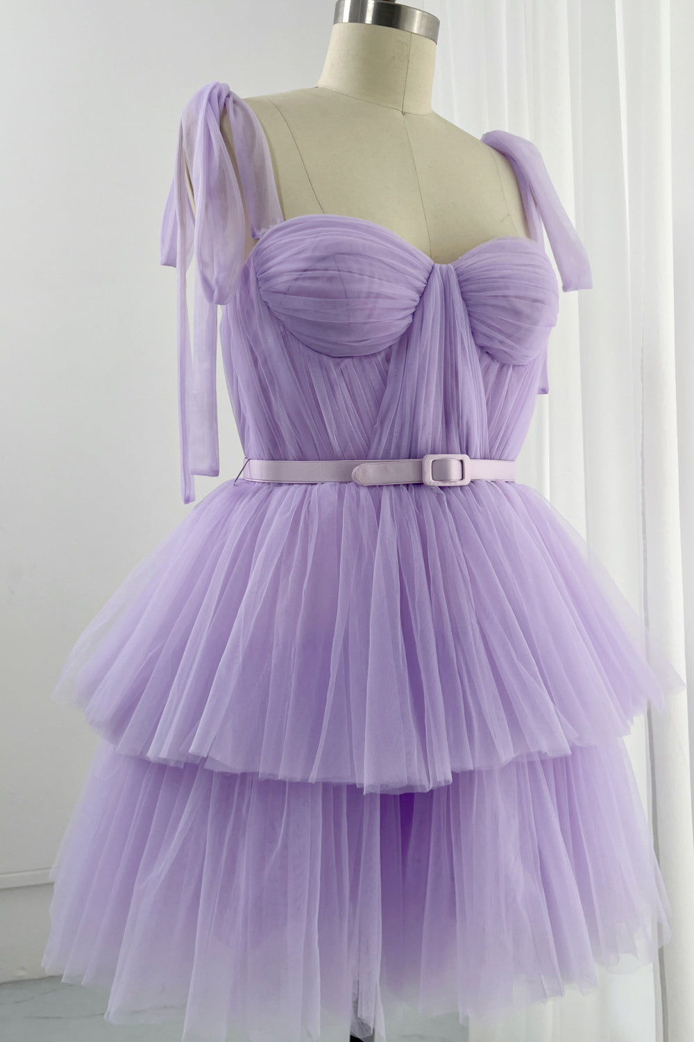 Event-ready lavender dress with belted waist and cascading tulle skirt designed for statement entrances