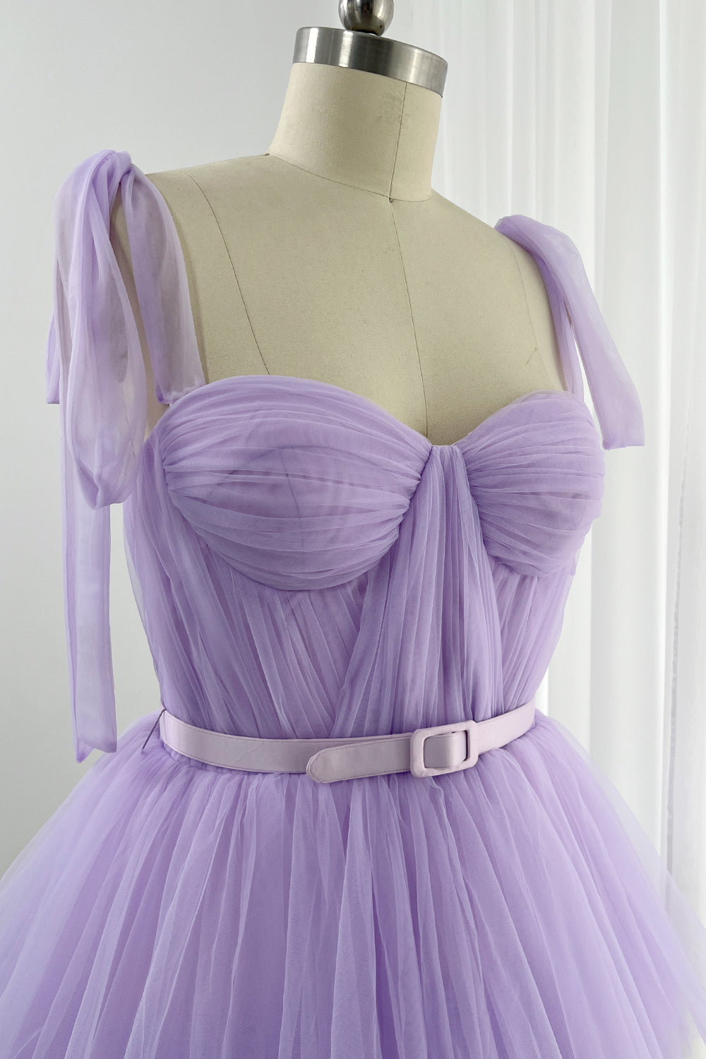 Strapless formal gown in lilac with tiered tulle construction and romantic aesthetic for grand occasions