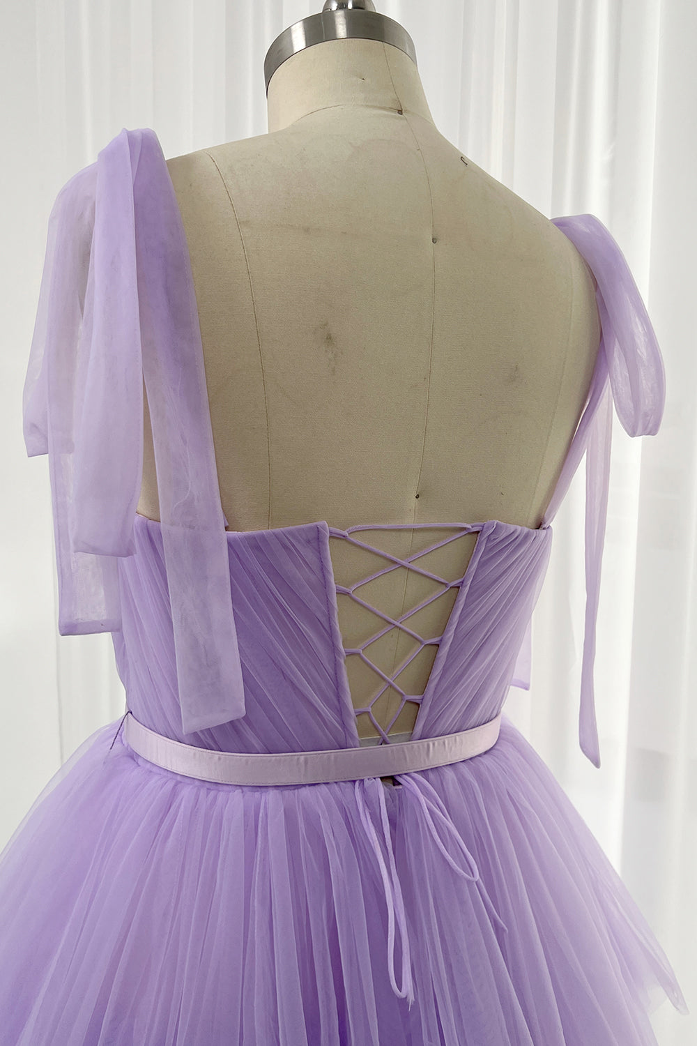 Fairy-inspired sweetheart dress in purple tulle layers for whimsical and elegant styled shoots