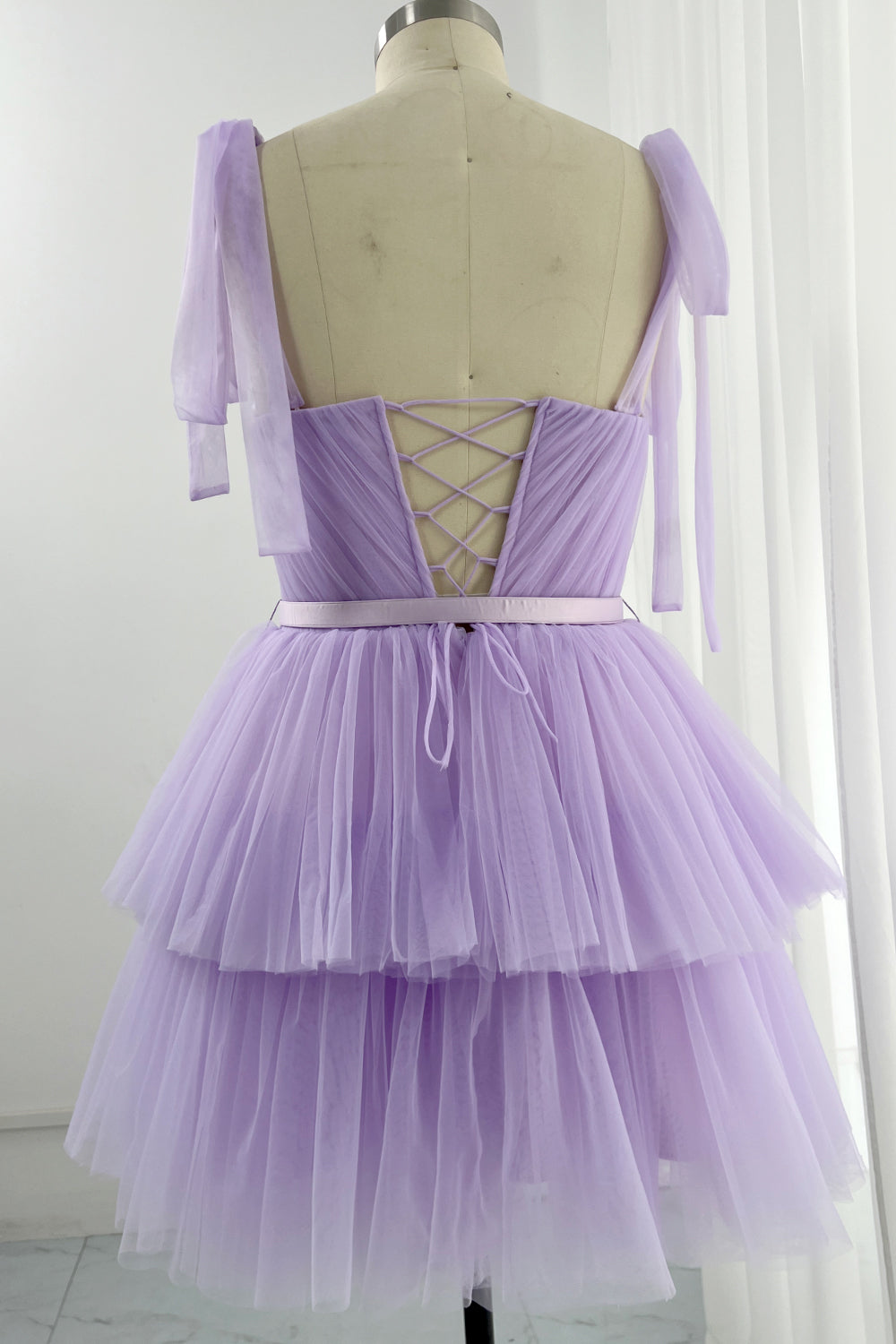 Cascading lilac tulle dress perfect for party looks with elegant strapless bodice and full maxi silhouette