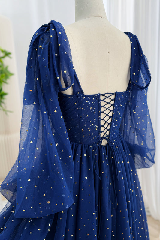 Back of a dark navy star and moon tulle formal dress with an adjustable lace-up corset closure