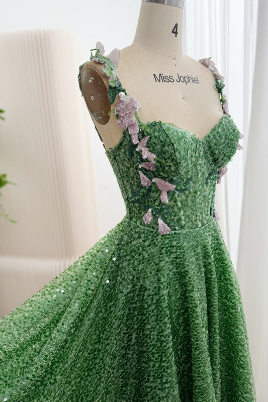 Front detail of green sequin gown with sweetheart bodice and pink floral appliqués