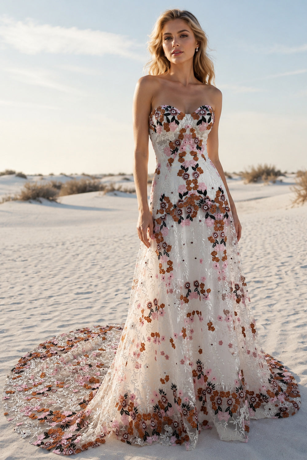 Model wearing a white floral embroidered strapless A-line wedding dress with a sweetheart neckline